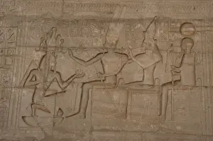 Relief depicting a Pharaoh Ramses II before gods Amun, Munt