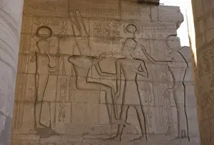 Relief depicting a Pharaoh Ramses II before gods Amun, Ptah