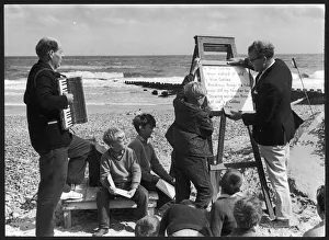 Accompaniment Gallery: Religious service being held on a beach