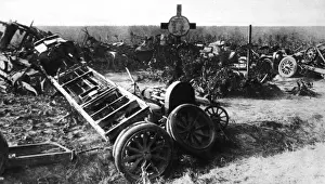 Grouped Prints: The remains off a German motor-transport convoy grouped round soldiers graves