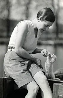 Broads Prints: Rene Fraser with pet ferret Mabel on the Norfolk Broads
