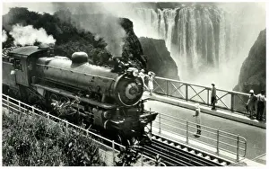Rhodesia Railways train crossing the Victoria Falls Bridge