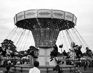 Excitement Prints: Riding carousel at fairground