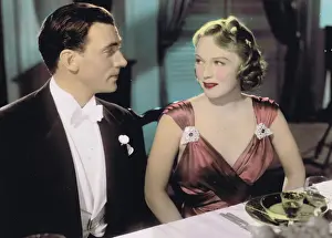 Rita Johnson wearing an evening gown designed by Dolly Tree