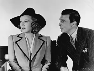 Enemies Prints: Rita Johnson wearing a smart Dolly Tree suit