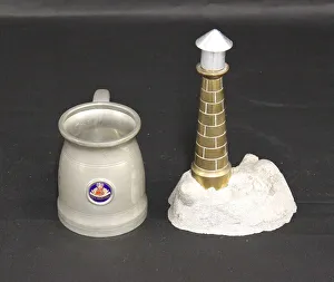 Images Dated 17th February 2015: RMS Mauretania souvenirs, tankard and lighthouse