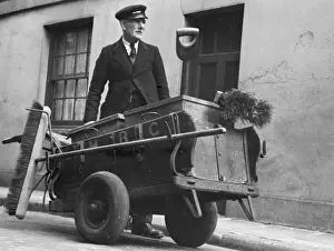 Road sweeper with his cart