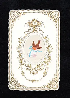 Robin with present on a Christmas card