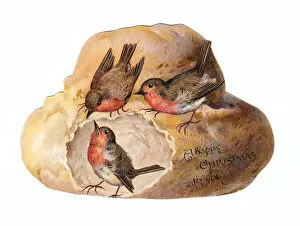 Robins with bread on a loaf-shaped Christmas card