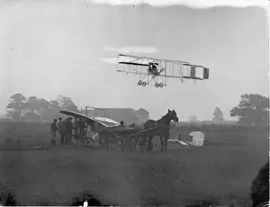 Roger Sommers Farman flying over Molons Bleriot monoplane