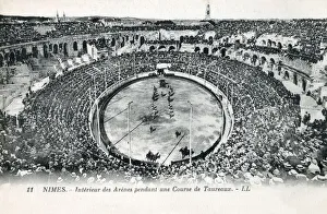 Amphitheater Collection: Roman Amphitheatre at Nimes, France - Bullfight. Built around 70 CE