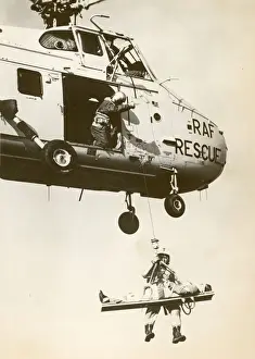 A Royal Air Force Westland Whirlwind winching a stretcher
