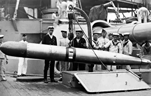 Royal Navy sailors with a torpedo