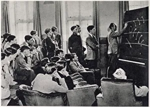 Rugby tactics being demonstrated to the school XV by Mr. Wort, the Housemaster of Talbot House. Date: 1959