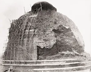 Bamboo Gallery: Ruined brick tower India with bamboo scaffolding