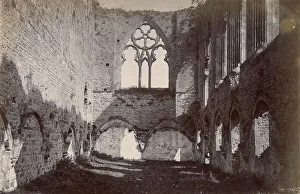 Ruined medieval building with large gothic window, North Wales Date: circa 1889