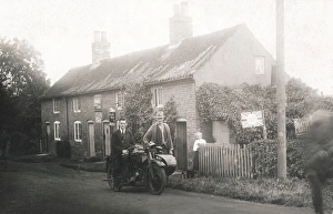Rural scene showing veteran motorcycle combination & cottage Rural scene showing veteran motorcycle combination & cottage