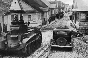 Russian armoured car rattles through Polish town, 1939