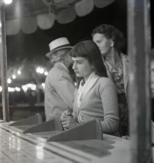 Amusements Gallery: Sad-looking girl at the fair