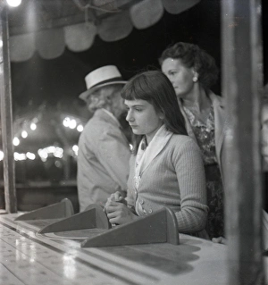 Amusements Gallery: Sad-looking girl at the fair