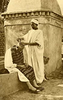 Images Dated 25th July 2018: Saharan barber and client, Algeria, North Africa