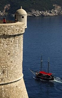 Sailboat sailing in Adriatic Sea, near the wall of Dubrovnik