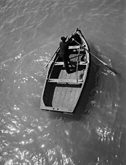 Sailor in rowing boat, Dieppe, France