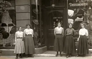 Assistants Prints: Sales assistants outside a dress shop