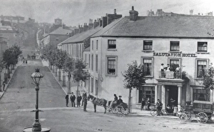 View of Salutation Square in Haverfordwest, Pembrokeshire, Dyfed, South Wales. The Salutation Hotel can be seen on the right, with a barouche outside which ferried guests to and from the railway station. The unusual lamppost on the left doubles as a water trough for horses Salutation Hotel, Haverfordwest, South Wales
