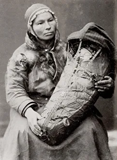 Sami woman with a baby in a papoose, Norway