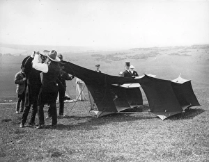 Adjusts Gallery: Samuel Cody adjusts his kite