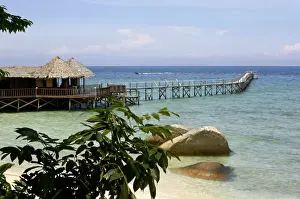 Sand beach, a bar and a jetty of the small Bagus