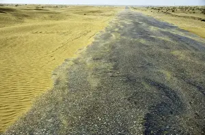 Habitats Prints: Sand dunes in a wind - Karakum desert encroach on a road