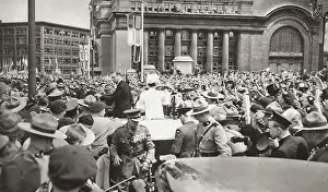 The scene after King George VI had unveiled the Canadian National War Memorial in Ottawa, Canada: their Majesties standing in their car to acknowledge the acclamations of a vast crowd. Date: 21st May 1939