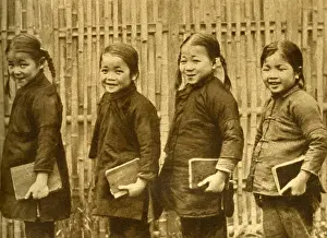 Four schoolgirls of Changsha with books, China, East Asia