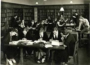 Studying Prints: Schoolgirls in uniform studying in a library
