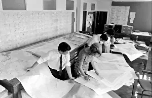 Examining Prints: Scientists examining maps and statistics at the Anti-Locust Research Centre (ALRC)