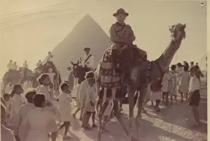 Pyramids Prints: Scout leader on camel in front of pyramid, Egypt