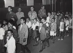 Scouts escorting earthquake victims, Greece