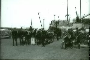Sea Scouts assembling on a quay