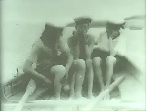Three Sea Scouts in a dinghy off TS Mercury