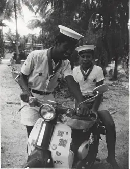 Sea scouts with moped, Gilbert Islands, Pacific
