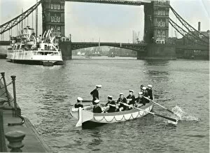 Images Dated 30th January 2012: Sea Scouts in a whaler near Tower Bridge, London