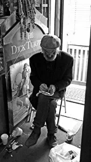 Images Dated 20th October 2012: Seated artisan working on an object, England