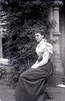 Images Dated 4th March 2015: Seated woman outside a house
