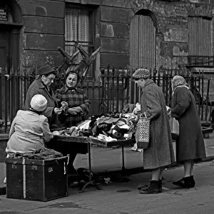 Londons Prints: Second hand clothes stall, street market, London