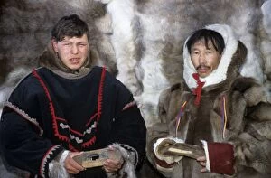 Siberia Collection: Selkup men in traditional clothes, holding traditional