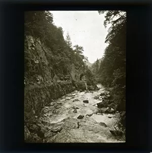 Sepia image of river, gorge and horse drawn cart