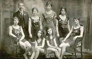 Pinned Prints: Seven female swimmers, five of them with medals