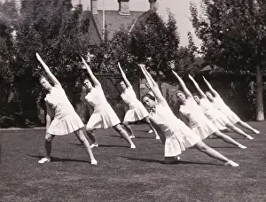 Stretches Prints: Seven perform stretches in garden